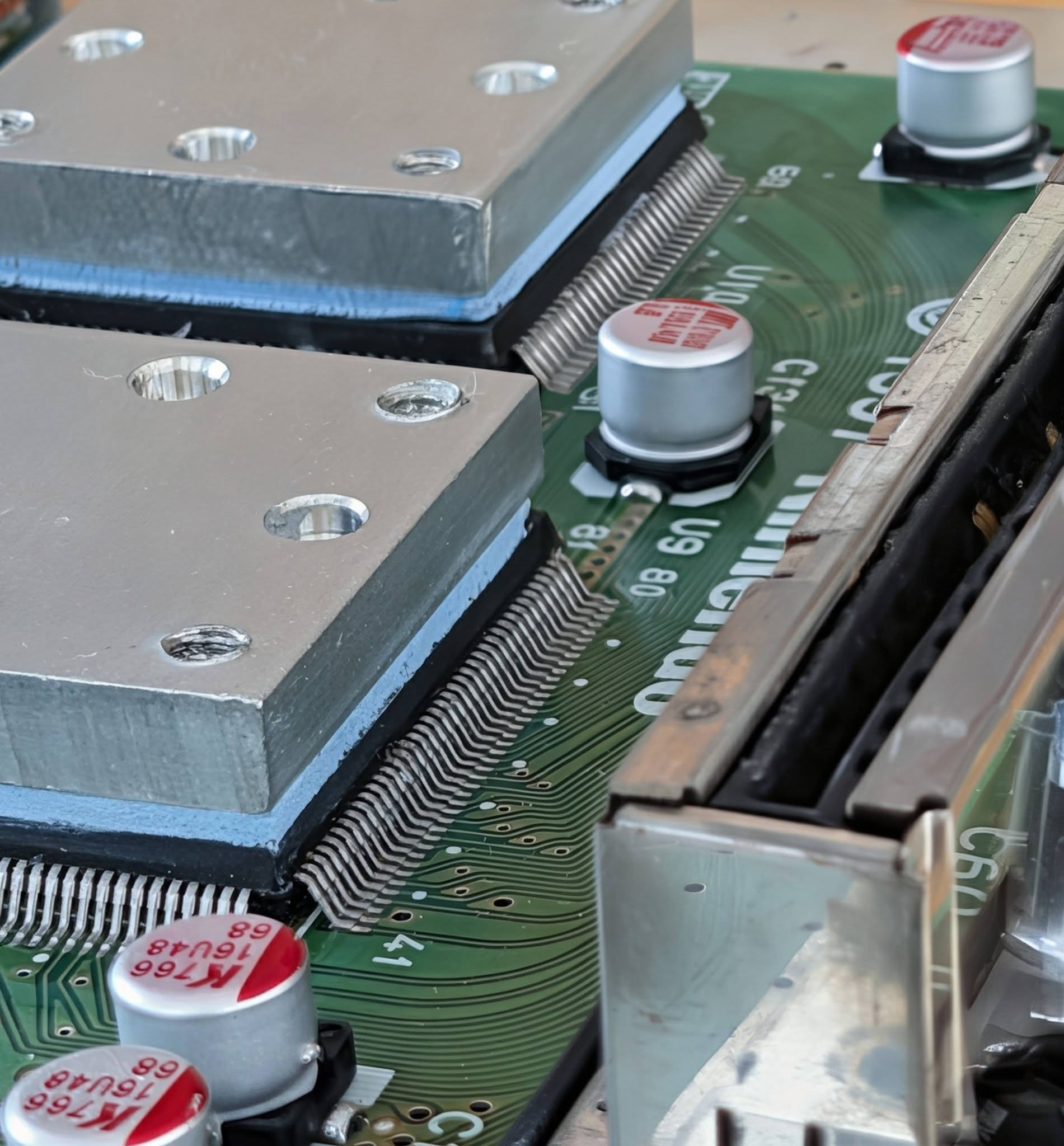 Nintendo 64 circuit board with new capacitors and fresh thermal pads installed by ReviveMyRetro
